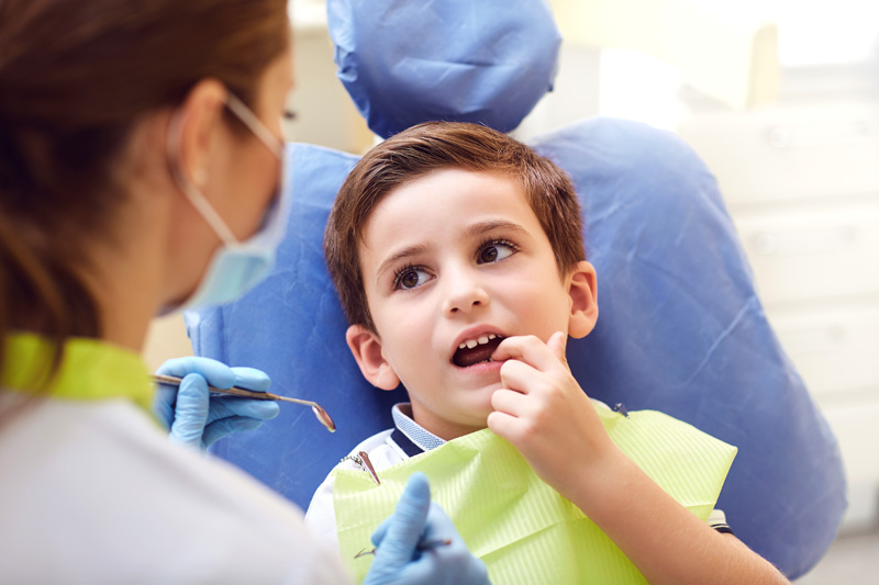 A child with dental care challenges in a dental office.