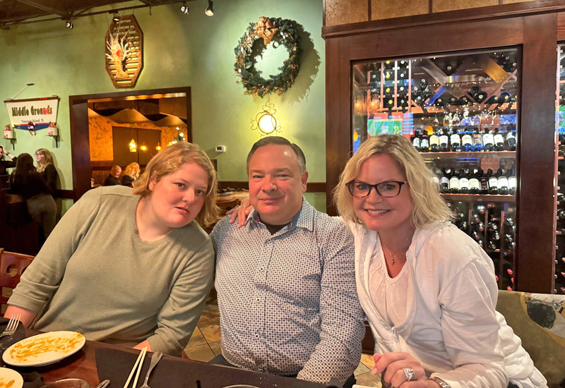 Devereux National Director of Family Engagement Amy Kelly (right) with her husband, Matt (middle), and daughter, Annie (left), during a recent trip to Florida.