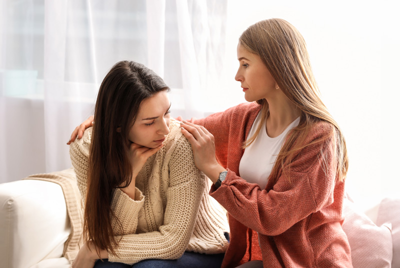 A friend comforting another friend 