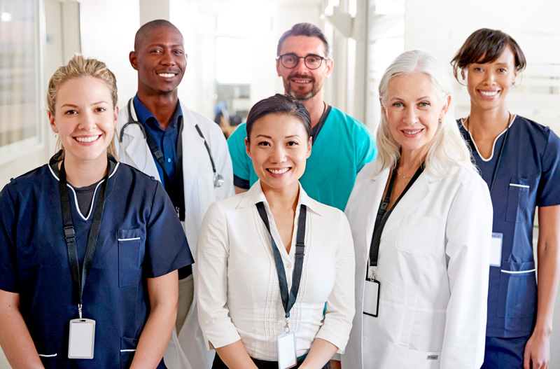 Medical Team Standing In Hospital Corridor