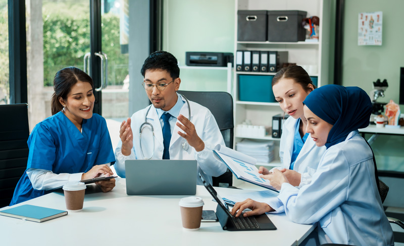 Medical professionals discussing around a table