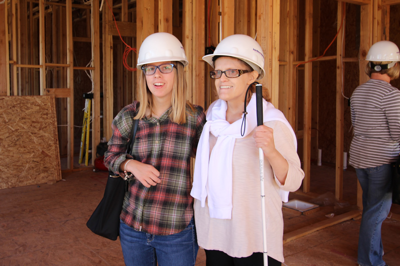 Lyndsey Eaton and Lauren Heimerdinger, future residents, check out the First Place–Phoenix construction site in 2016. Photo credit: Good Eye! Media