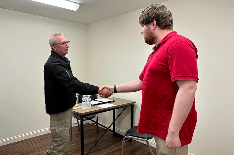 Ronnie Ward from the Bowling Green Police Department meets LifeWorks 2024 graduate Noah Thomas for a mock interview to practice interview skills and help Noah become more comfortable sharing about himself and the type of work he likes to do.