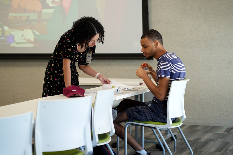 Director of Employment and Workforce Development Natasha Grant Holmberg works with a jobseeker participating in Be Ready℠, First Place AZ’s job readiness program.