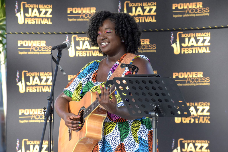 Singer, The Voice Inside actress, guitarist, and composer Kaylah Taylor performs her original song "Autism Speaks" at the South Beach Jazz Festival. Credit: Zachary Hoaglund