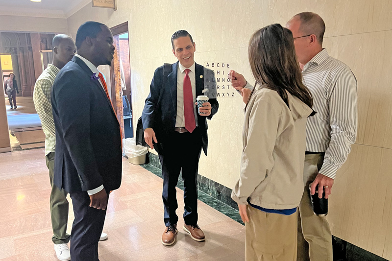 My daughter speaking with New York State assembly members at the capitol 