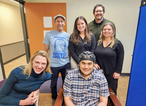 Isaiah takes a break from HD-DOT data collection surrounded by (left to right) Morgan; Dr. Stewart Mostofsky, Director, Center for Neurodevelopmental and Imaging Research, Kennedy Krieger Institute (KKI); Alice Sperry, KKI; Adam Eggebrecht, Associate Professor of Radiology, Washington University Medicine Mallinckrodt Institute of Radiology; Deana Crocetti, KKI