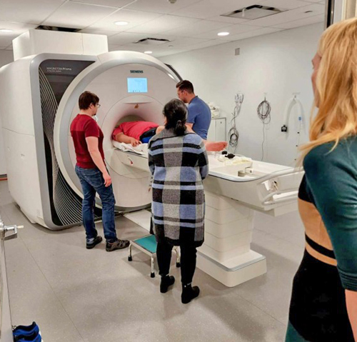 Morgan looks on as Isaiah is positioned for an fMRI scan at Toronto Neuroimaging Facility by MRI Physicist Lars Kasper and MRI Technologist John Milne. Isaiah’s mother, Melody Tien Grewal, provides regulation support.
