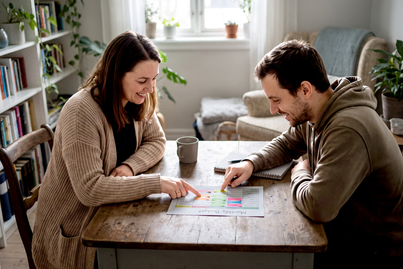 Coach And Client Reviewing Budget Chart